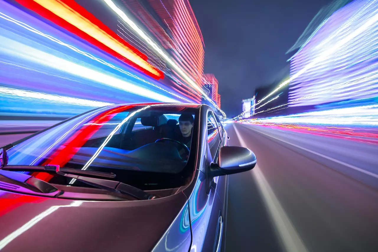 Car in blurred city lights