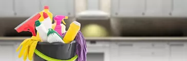 Cleaning products against blur kitchen interior background