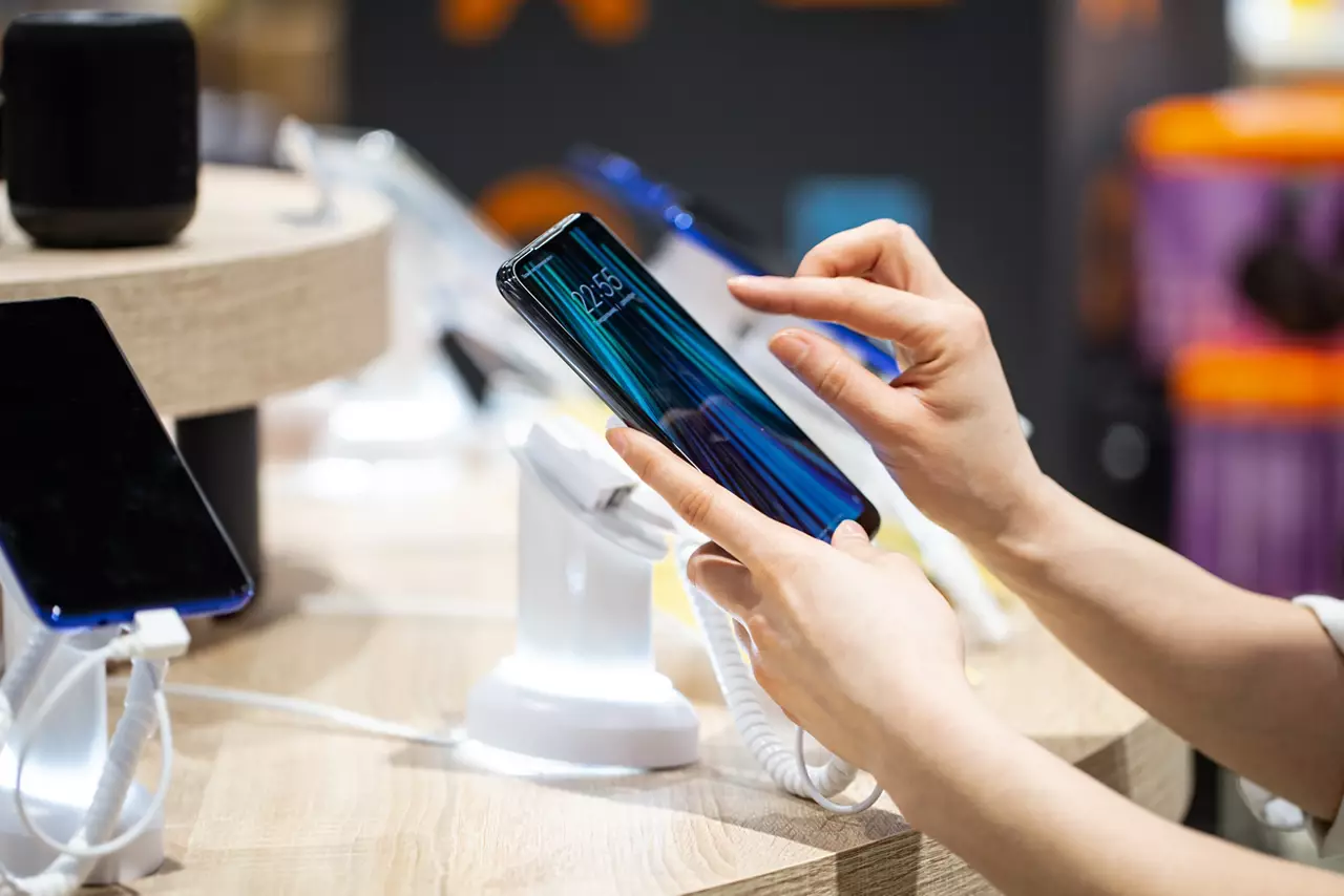 hands scrolling on smartphone screen
