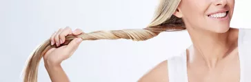 Beautiful Young Woman Holding Hair