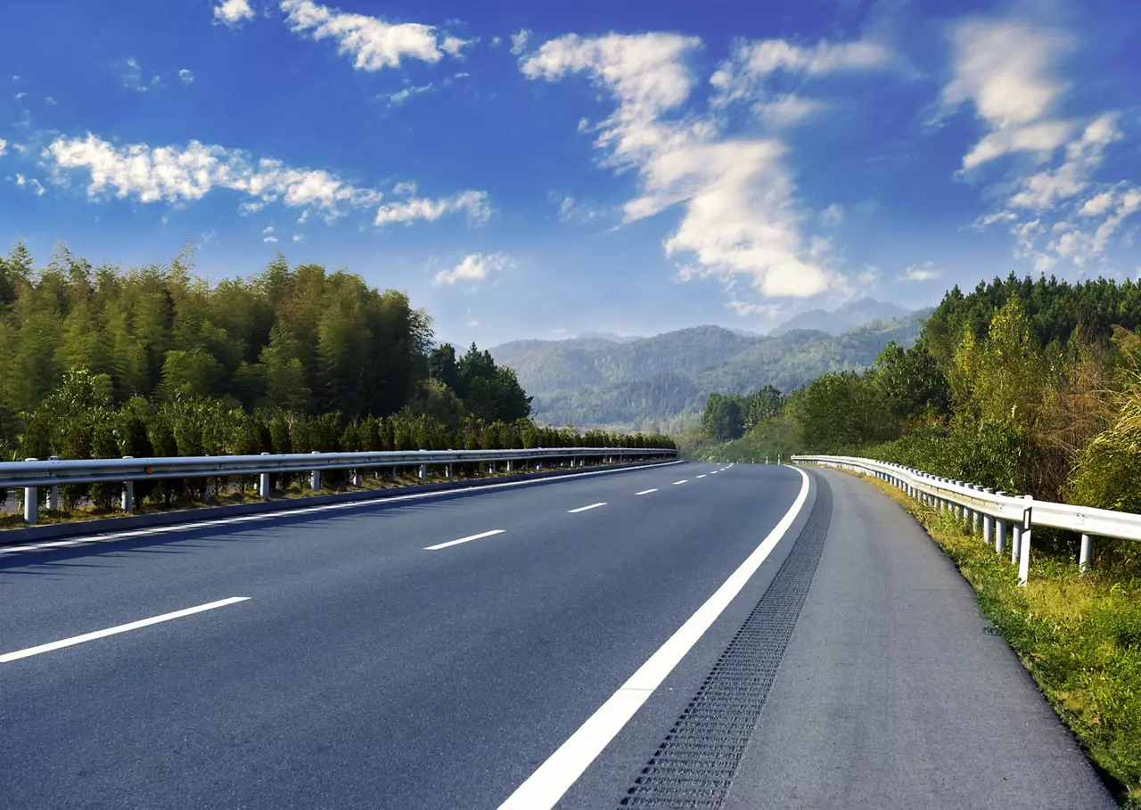 Highway in the country against blue sky
