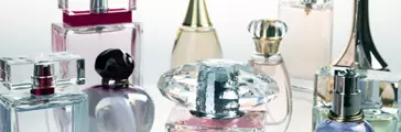 Many perfume bottles and caps with various designs