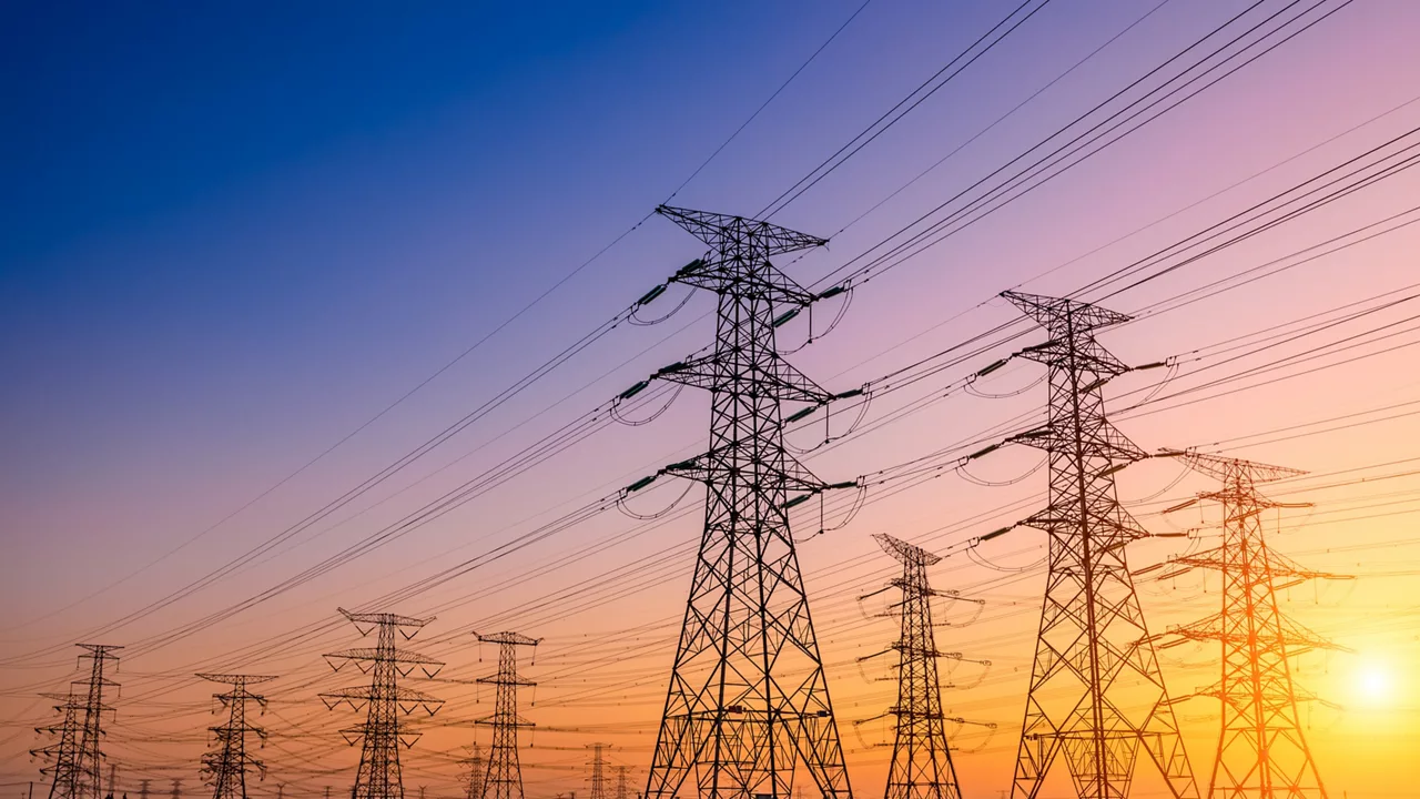 High voltage electricity tower at sunset