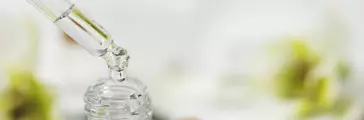 pipette with flower essential oil drop